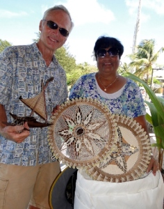 Cruiser Robert Yapp donates a sail to Ailuk. Grateful Mayor Rufina Jack gave him handicrafts in return.