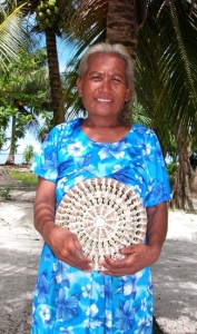 A resident of Aur offers a basket for sale. Photo: Karen Earnshaw