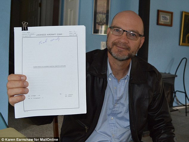Dick Spink holding a Lockheed fuel report