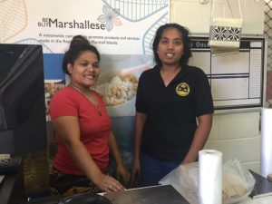 Brenda Menwe, left, and Jacklina Thomas take care of the cash register at MISCO Market. Photo: Karen Earnshaw