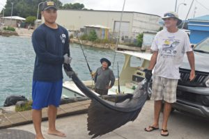 James Myazoe junior, James Myazoe (onWasabi) and Cary Evarts with their sailfish. Photo: Karen Earnshaw