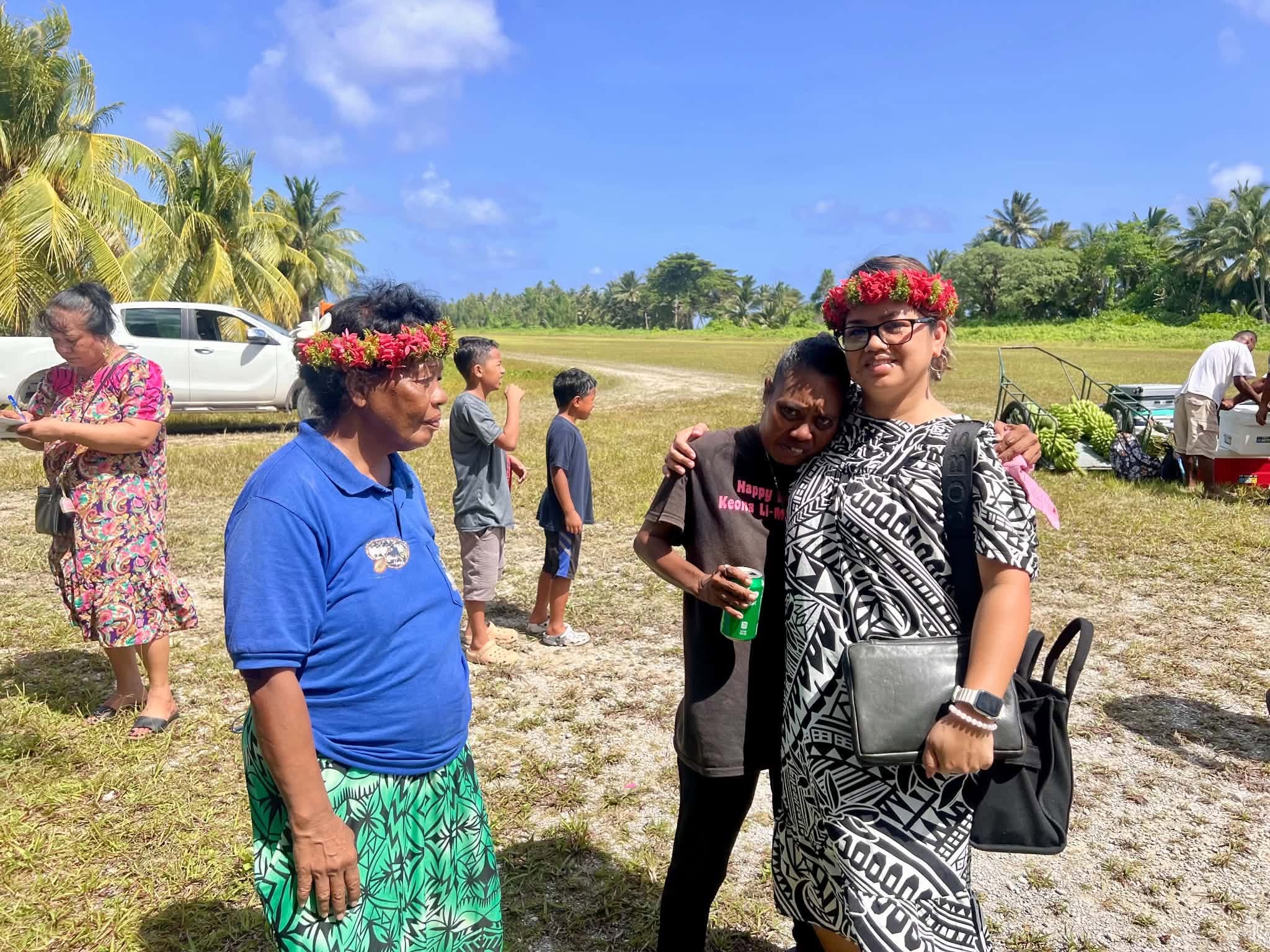 Kili Island, Christmas 2025 — three women embracing in an emotional moment
