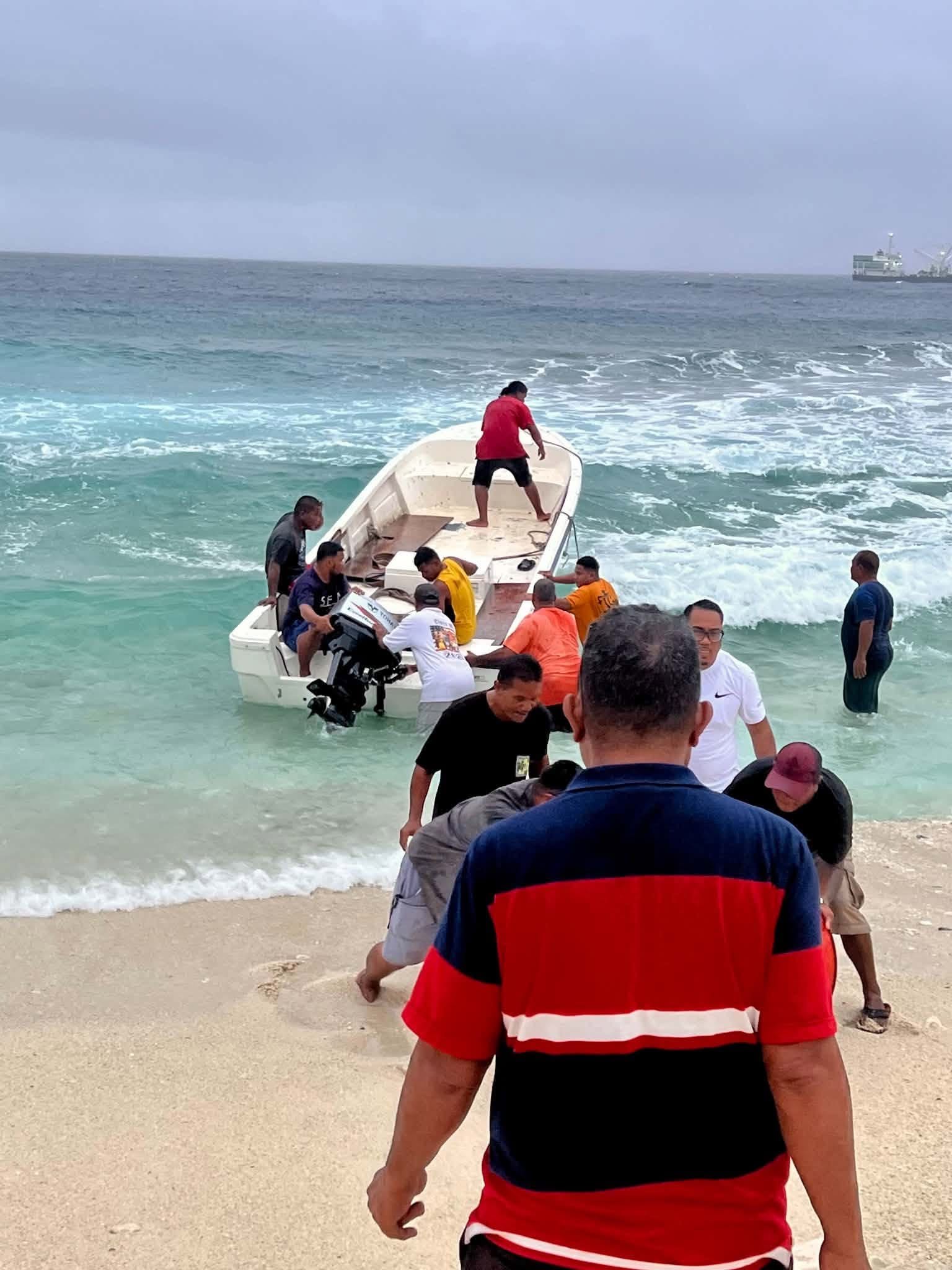 Kili Island, Christmas 2025 — a boat being brought ashore through the surf