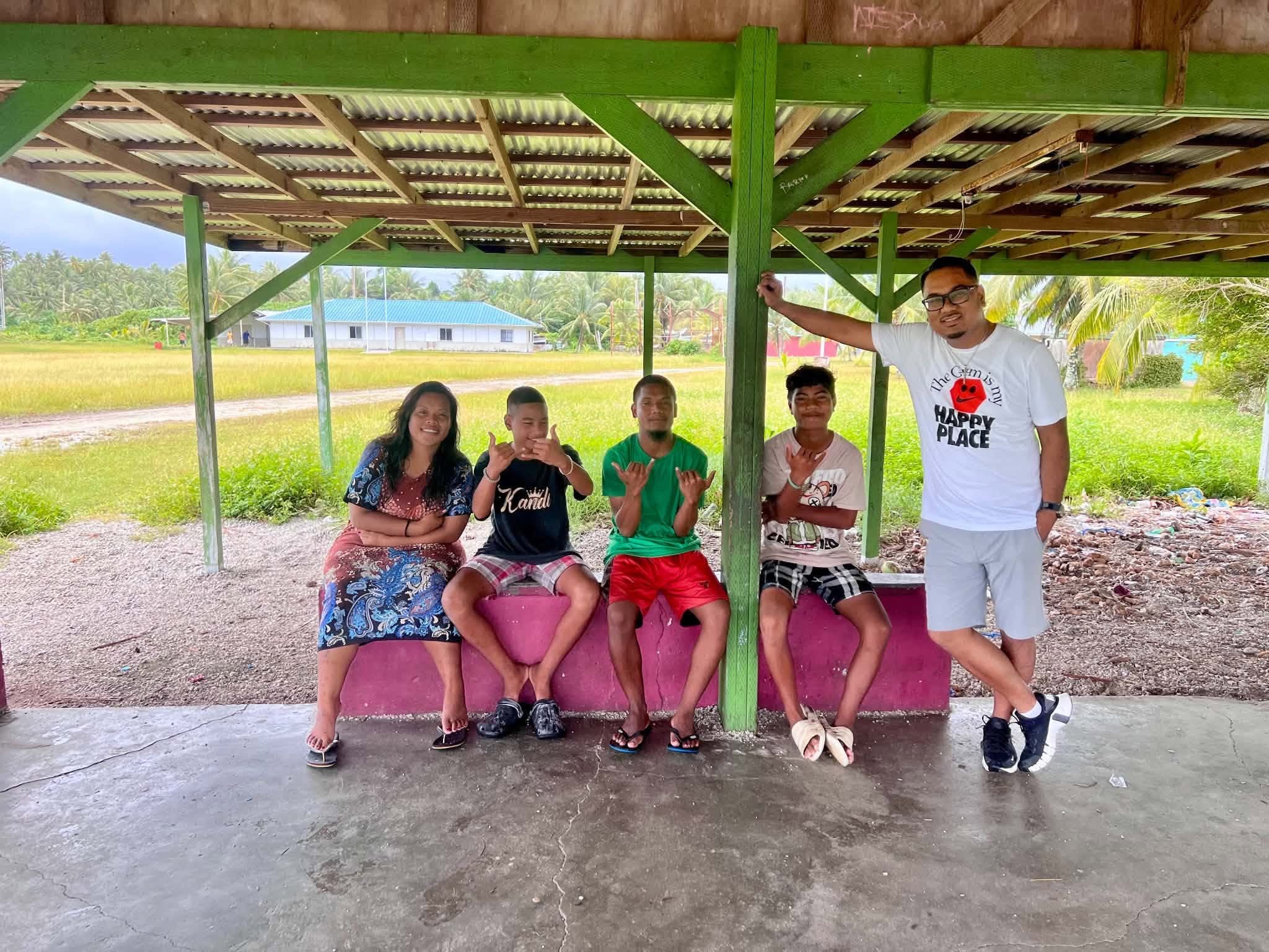 Kili Island, Christmas 2025 — a group posing together under a pavilion