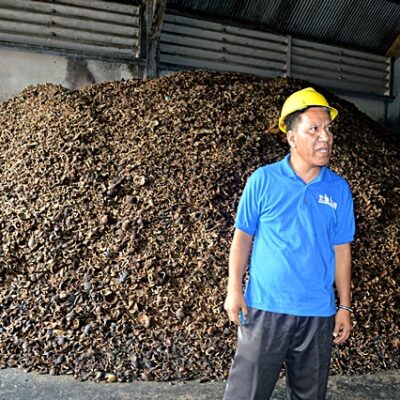 Tobolar's marketing man Mison Levai explains the process of turning copra into oil and other products. Photo: Karen Earnshaw