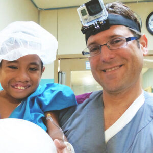 A Canvasback Missions doctor with a young patient.