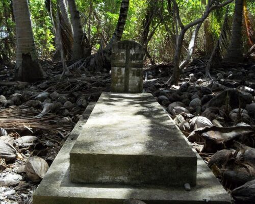 A grave nestled beneath the trees on Ujelang Atoll. Photo Mores Abraham