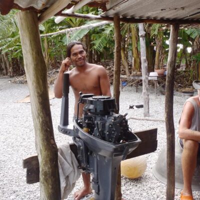 Cruisers try and fix a Mili man's outboard.