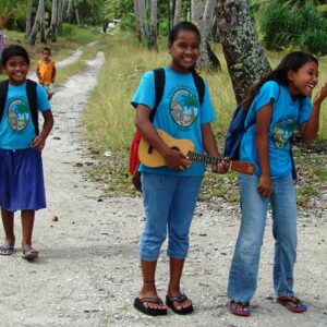 A trio of Likiep Elementary girls giggle at being photographed. Photo Karen Earnshaw