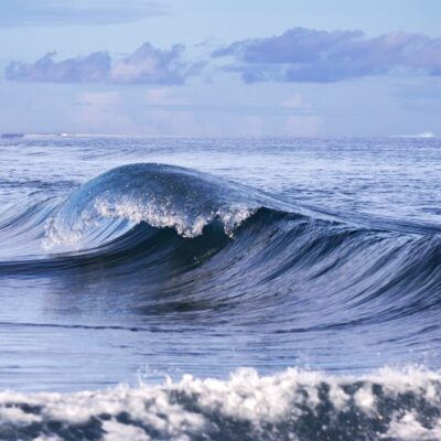 A curling wave taken from the pier at Majuro Bridge. Photo: Jamison Logan.