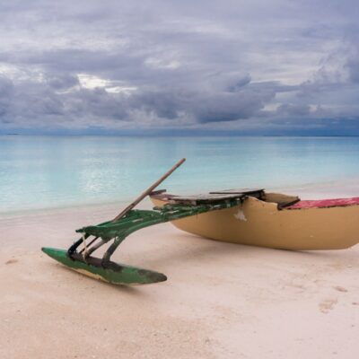 A canoe sits under a low sky in Arno Atoll. Photo: Jamison Logan.