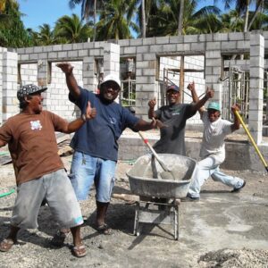 A construction team builds an elementary school on Aur Atoll.