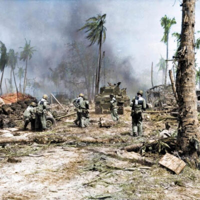 Soldiers make their way across the barren landscape in Kwajalein, Marshall Islands, 1944.