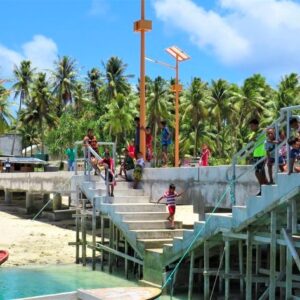 Children play on the dock at Lib Island. Photo: Deo Keju.