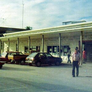 Al Fewkes walks out of Reimers Market in 1976.
