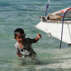 Playing in the shallows off Ailuk's main village. Photo: Karen Earnshaw