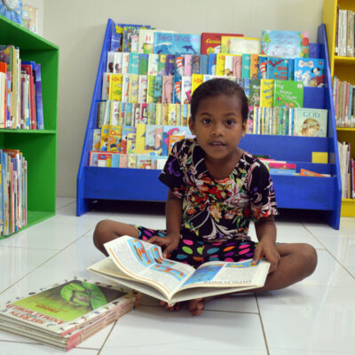 A young girl was spotted looking at a selection of books in the children's section of the Alele Library. Photo: Karen Earnshaw