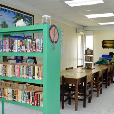 Two gentlemen do some research in the Alele Library, Uliga. Photo: Karen Earnshaw