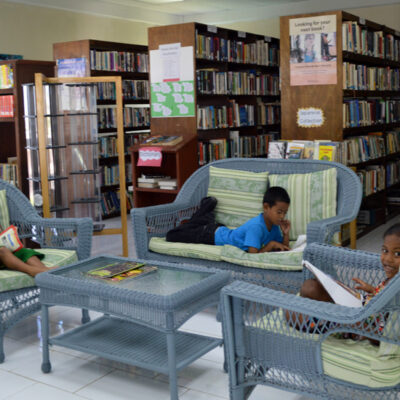Children enjoy the comfort of the living-room style seating in the Alele Library. Photo: Karen Earnshaw