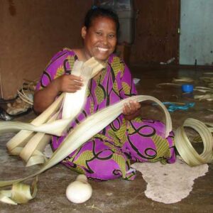 Heldha Mack works with the dried pandanus leaves she will use to make handicrafts.