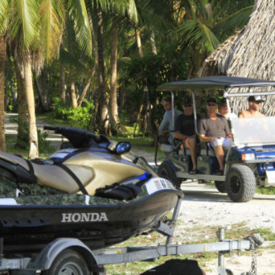 Getting around Beran Island, Ailinglaplap, on a golf cart.