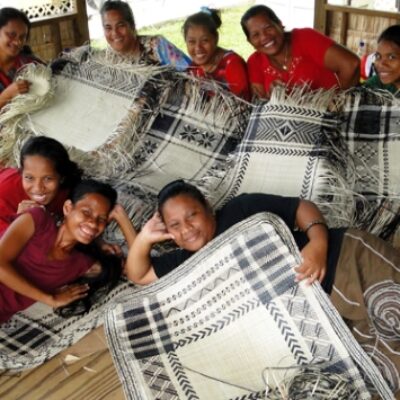 Weavers in the weaving house at the back of USP's campus. Photo: Karen Earnshaw