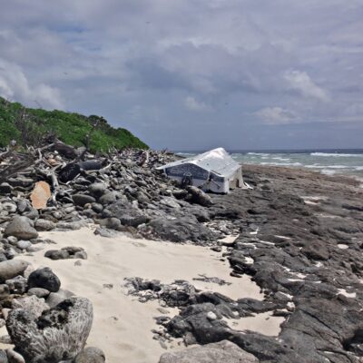 An overturned boat on the shores of Jemo Island. Photo: Nicky deBrum.