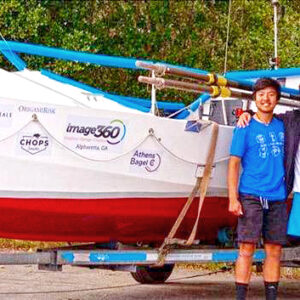 Friends Christopher Lee and Jacob Pope with their rowing boat. Photo: Unknown
