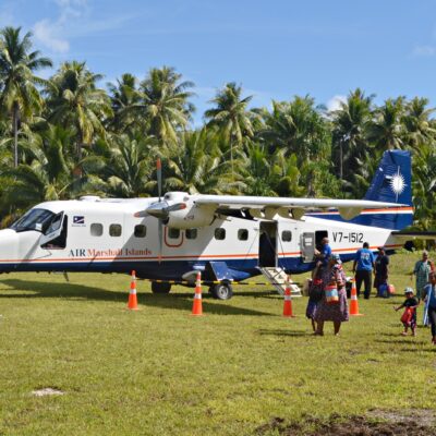 Passengers disembark from an AMI plane at Maloelap. Photo: Karen Earnshaw