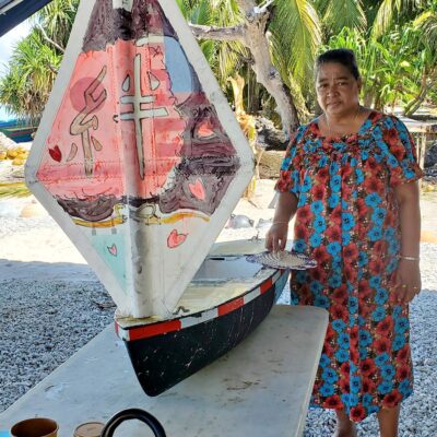 Ailuk’s Ruthy Typhoon with the SV Liberty, which is one of numerous small boats created by the children at the Columbia River Maritime Museum in Oregon. Photo: Mayor Ankit Typhoon.
