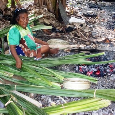 Namdrik's Sera Hosia prepares to cook the pandanus leaaves. Photo: USP