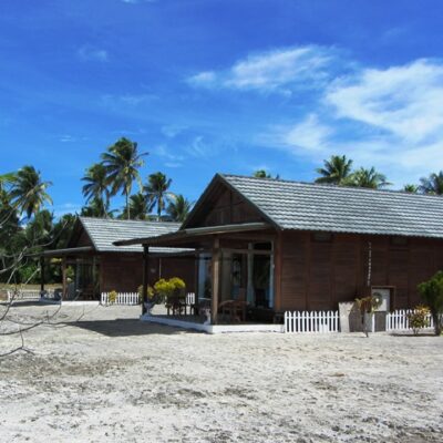 The pretty beachside cottages at Rongelap. Photo: Tom Vance