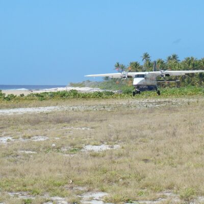 An Air Marshall Islands plane lands on the Utrik runway. Photo: Unknown