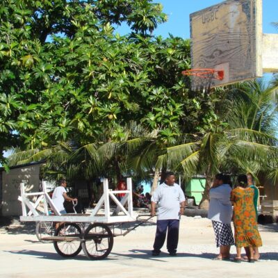 Having a chat on Utrik's basketball court. Photo: Giff Johnson.