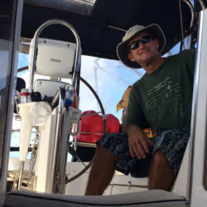 Captain Cary in the cockpit of Wind Ryder.