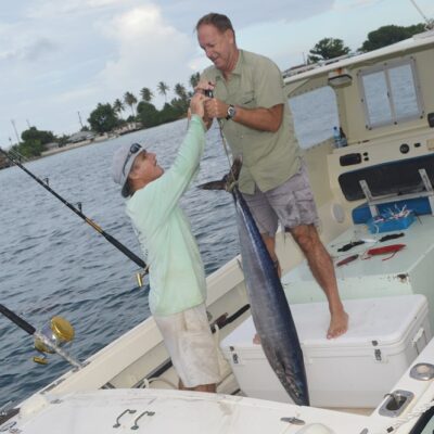 Wasabi Captain Cary Evarts and Willard Lathrop weigh their 45-pound wahoo. Photo: Karen Earnshaw