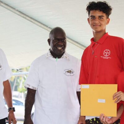 Minister Dennis Momotaro, and PNA head Ludwig Kumoru with Coop School students Xavier Williams and Yale Kramer who won special recognition for their tuna documentary. Photo: Rebecca Lathrop.